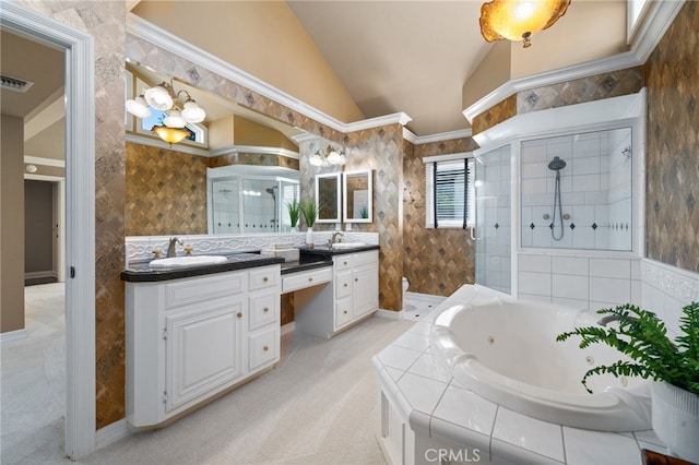 bathroom featuring ornamental molding, vanity, plus walk in shower, and vaulted ceiling