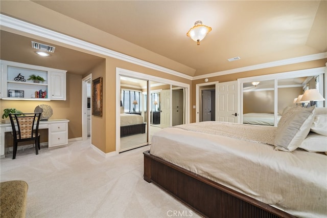 bedroom with crown molding, built in desk, vaulted ceiling, and light colored carpet