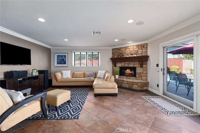 tiled living room with ornamental molding and a stone fireplace