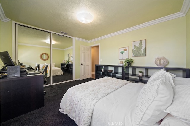 carpeted bedroom featuring a closet, crown molding, and a textured ceiling