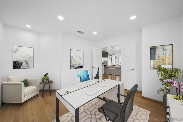 home office with light wood-type flooring