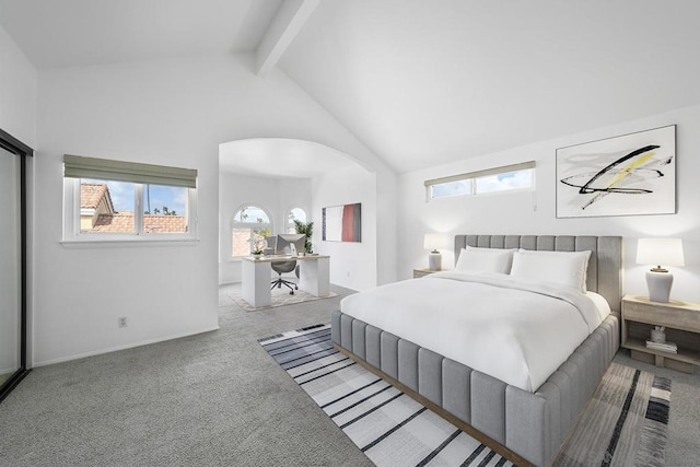 bedroom featuring beam ceiling, high vaulted ceiling, and light colored carpet