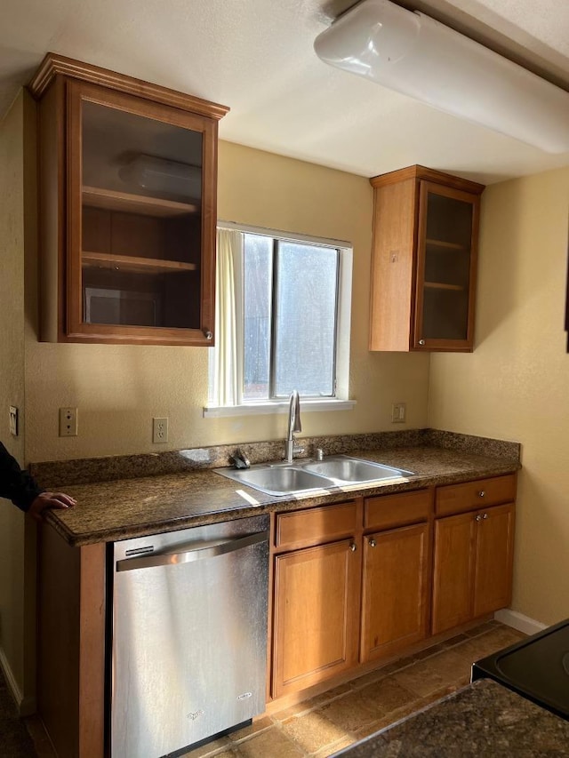 kitchen featuring sink, stainless steel dishwasher, and range