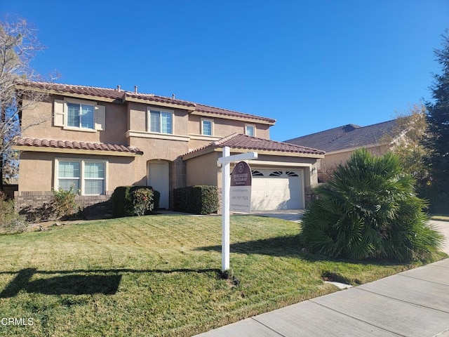 mediterranean / spanish home with a garage and a front yard