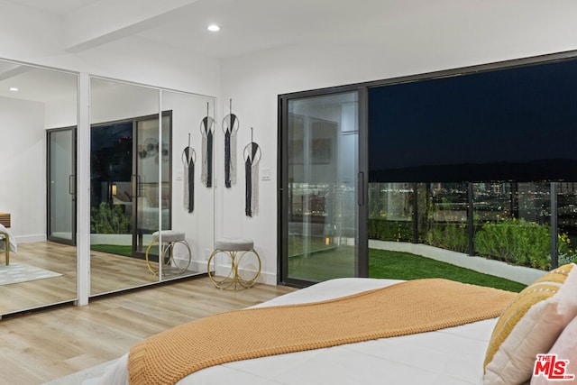 bedroom with wood-type flooring