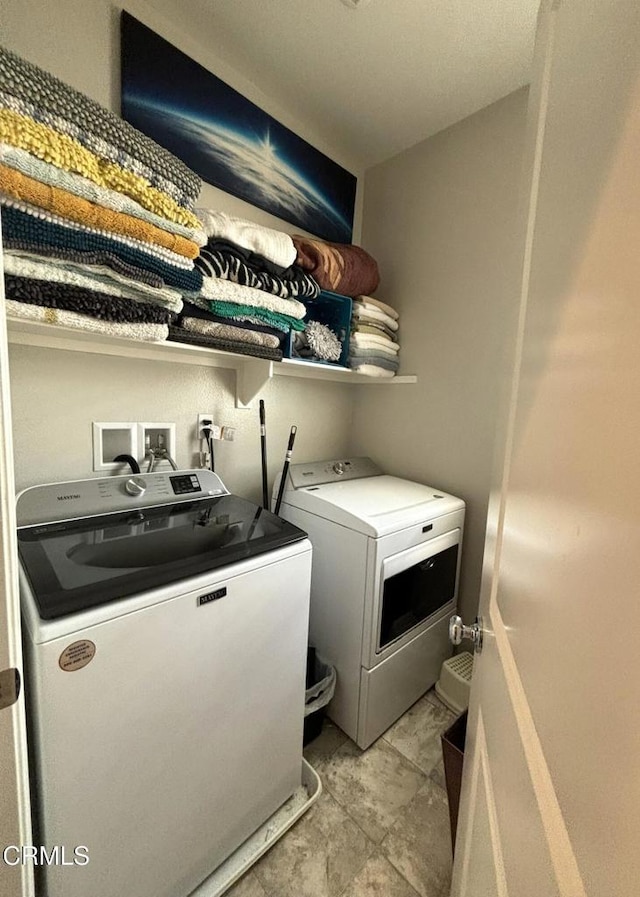 laundry area featuring washing machine and dryer