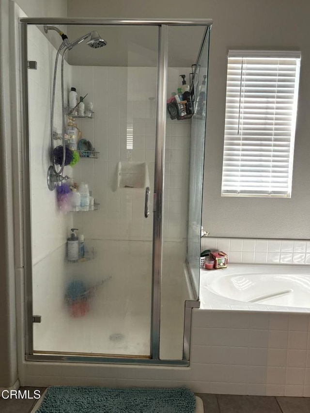 bathroom featuring tile patterned floors and plus walk in shower