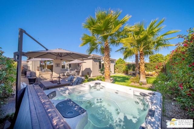 view of swimming pool featuring a hot tub