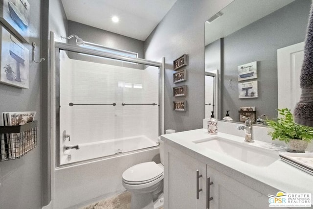 full bathroom featuring toilet, combined bath / shower with glass door, and vanity