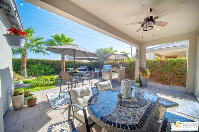 view of patio / terrace featuring ceiling fan, area for grilling, and grilling area