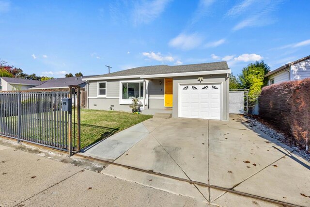 ranch-style home with a front lawn and a garage