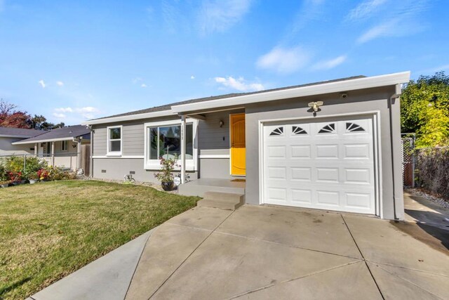 ranch-style home featuring a garage and a front yard