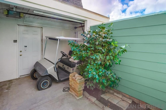 exterior details featuring a garage door opener