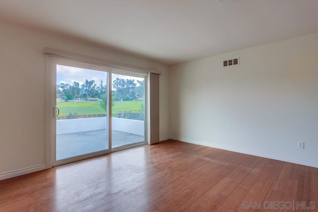 spare room featuring light hardwood / wood-style floors