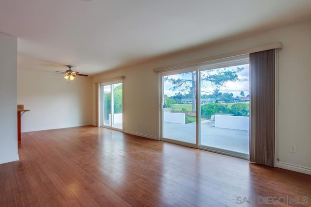 spare room with ceiling fan and hardwood / wood-style floors