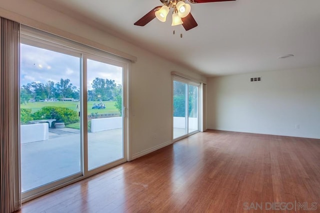 spare room featuring ceiling fan and light wood-type flooring