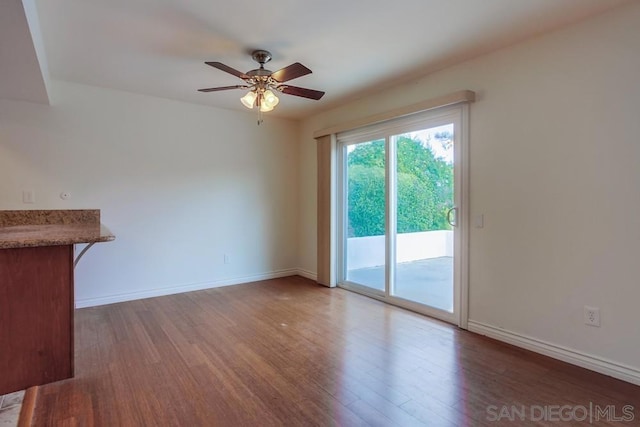 unfurnished living room with hardwood / wood-style floors and ceiling fan