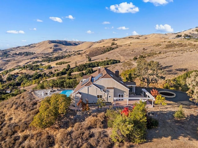 drone / aerial view featuring a mountain view