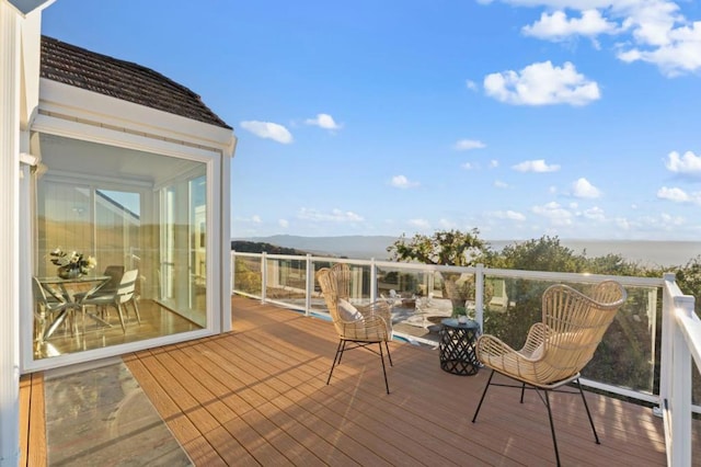 wooden terrace featuring a mountain view