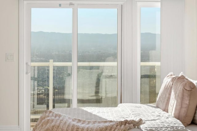 bedroom featuring a mountain view