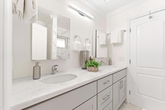 bathroom with vanity, crown molding, and tile patterned flooring