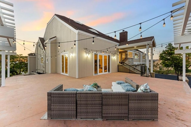 patio terrace at dusk with an outdoor living space