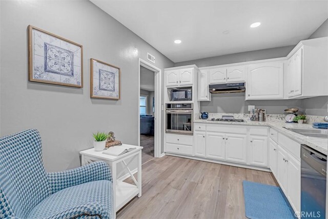 13621 Arcturus Ave, Gardena, CA 90249 - kitchen with stainless steel oven, dishwasher, black microwave, gas stovetop, and under cabinet range hood