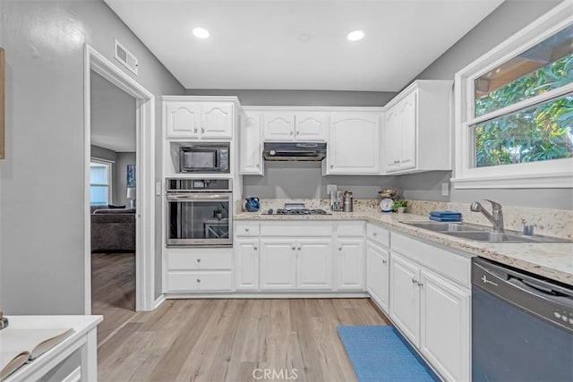 13621 Arcturus Ave, Gardena, CA 90249 - kitchen with oven, dishwasher, black microwave, gas cooktop, and light wood-type flooring
