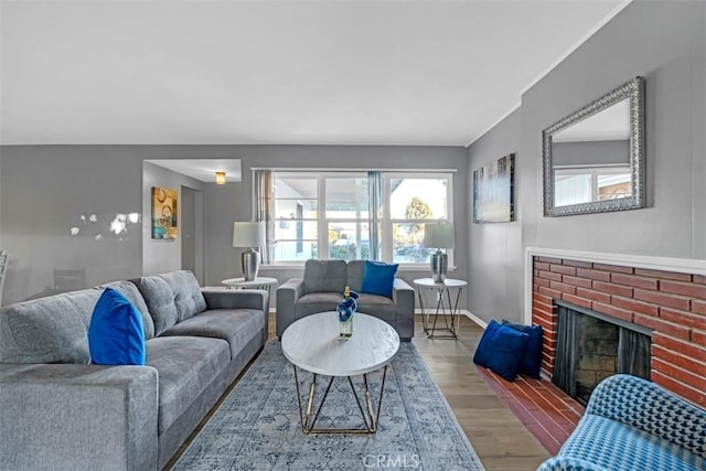 13621 Arcturus Ave, Gardena, CA 90249 - living room featuring wood finished floors and a brick fireplace