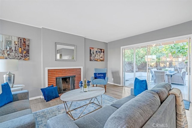 13621 Arcturus Ave, Gardena, CA 90249 - living room featuring wood finished floors and a fireplace
