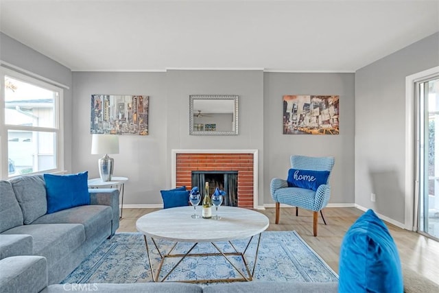 13621 Arcturus Ave, Gardena, CA 90249 - living room featuring a fireplace and light wood-style flooring