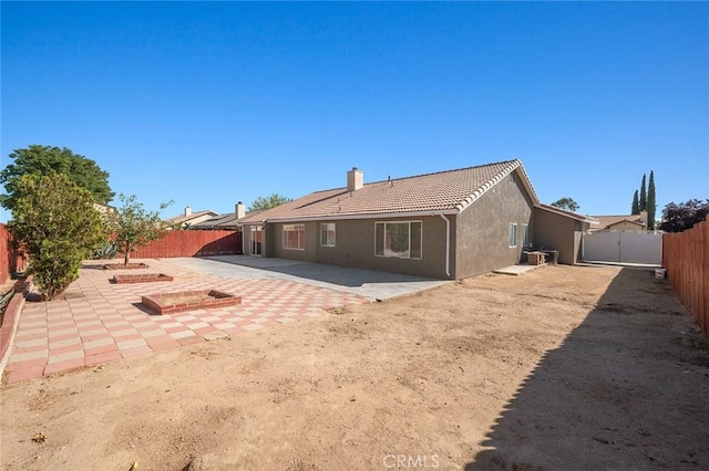 rear view of house featuring a patio area