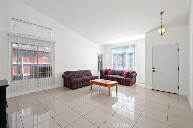 tiled living room with vaulted ceiling