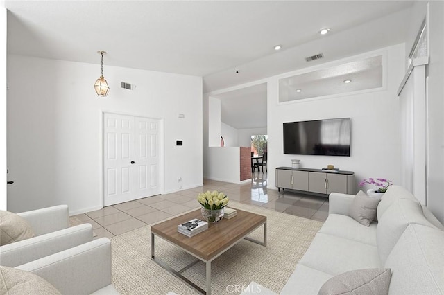 living room with tile patterned flooring