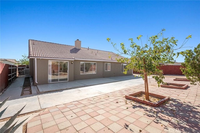 rear view of house with a patio