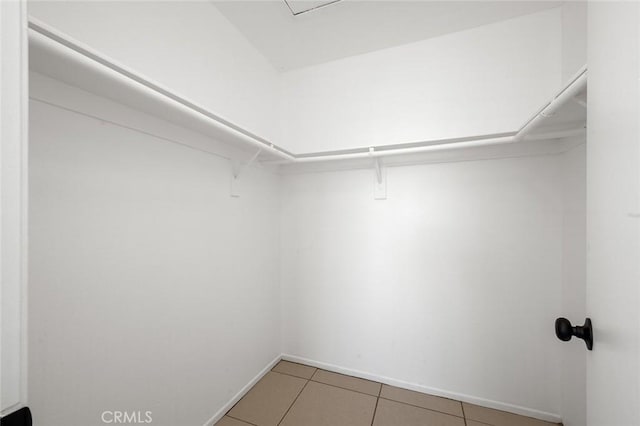 spacious closet featuring tile patterned floors