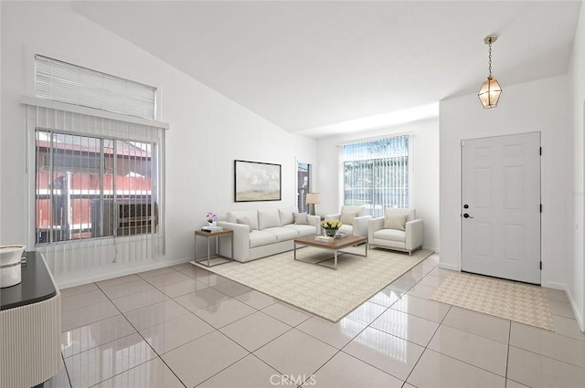 living room with light tile patterned floors and vaulted ceiling