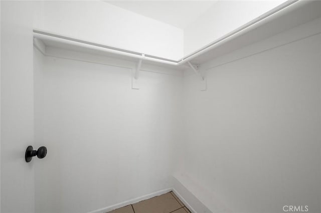 walk in closet featuring tile patterned floors