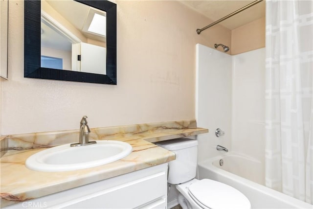 full bathroom with toilet, vanity, and  shower combination