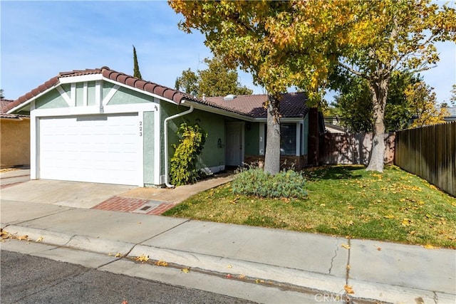 single story home featuring a front lawn and a garage