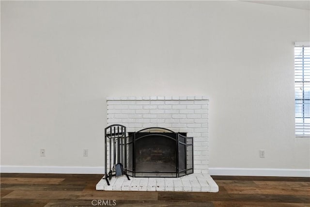 details featuring a fireplace and hardwood / wood-style floors