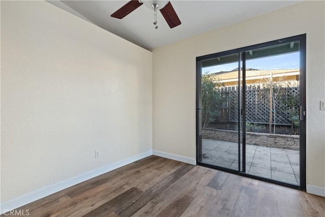 unfurnished room with ceiling fan and hardwood / wood-style floors