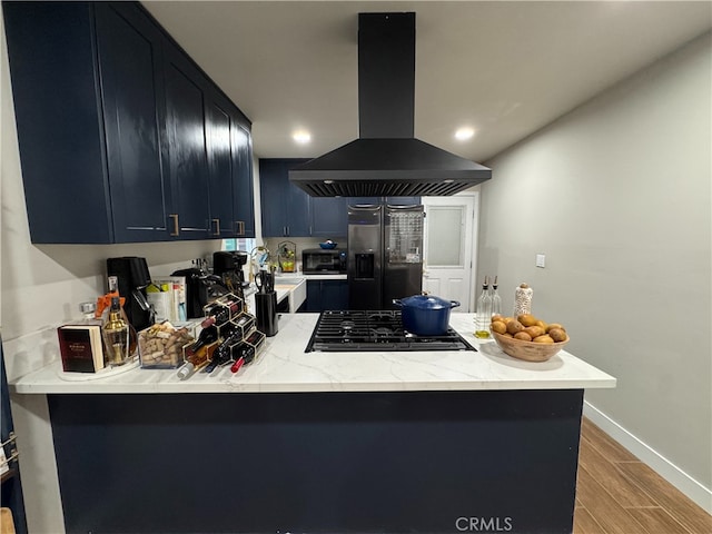 kitchen with kitchen peninsula, black gas cooktop, island exhaust hood, and refrigerator with ice dispenser