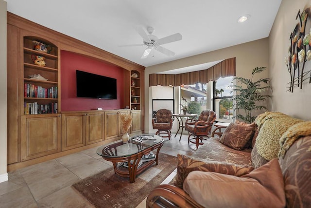 tiled living room featuring ceiling fan and built in features