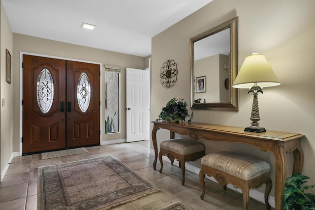 foyer featuring light tile patterned floors