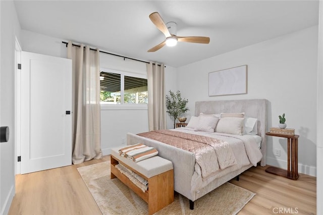 bedroom featuring ceiling fan and light hardwood / wood-style flooring