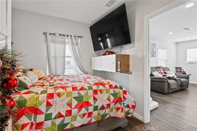 bedroom featuring wood-type flooring