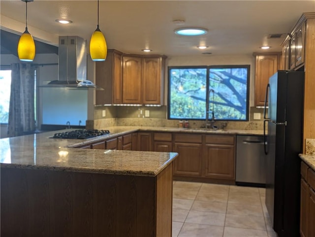 kitchen with pendant lighting, black appliances, ventilation hood, kitchen peninsula, and light tile patterned floors