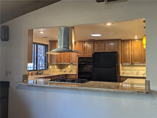 kitchen with black appliances, ventilation hood, light stone countertops, and tasteful backsplash