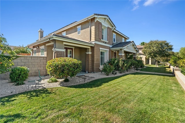 view of home's exterior with a yard